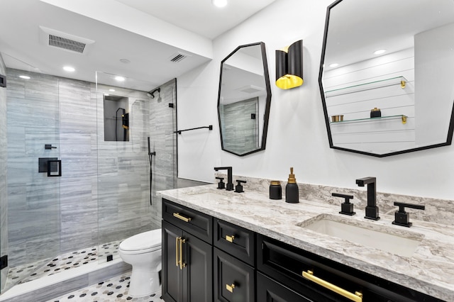 899 Jeffery St Unit 414, Boca Raton, FL 33487 - full bathroom featuring toilet, double vanity, a shower stall, and recessed lighting