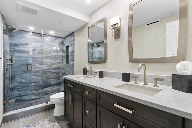899 Jeffery St Unit 414, Boca Raton, FL 33487 - full bath featuring double vanity, toilet, tile patterned floors, a shower stall, and recessed lighting