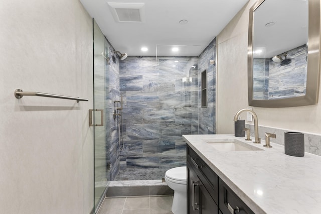 899 Jeffery St Unit 414, Boca Raton, FL 33487 - bathroom featuring toilet, vanity, a stall shower, tile patterned floors, and recessed lighting