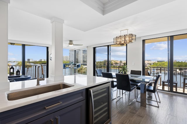 899 Jeffery St Unit 414, Boca Raton, FL 33487 - kitchen featuring wine cooler, a sink, a water view, and hanging light fixtures