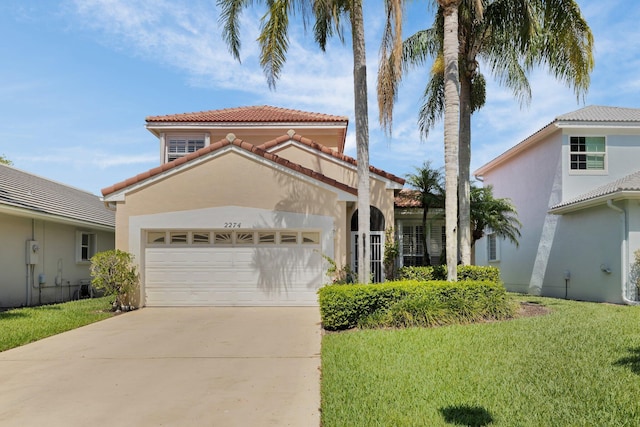 2274 SW Olympic Club Ter, Palm City, FL 34990 - mediterranean / spanish-style home with a tiled roof, stucco siding, a garage, concrete driveway, and a front lawn