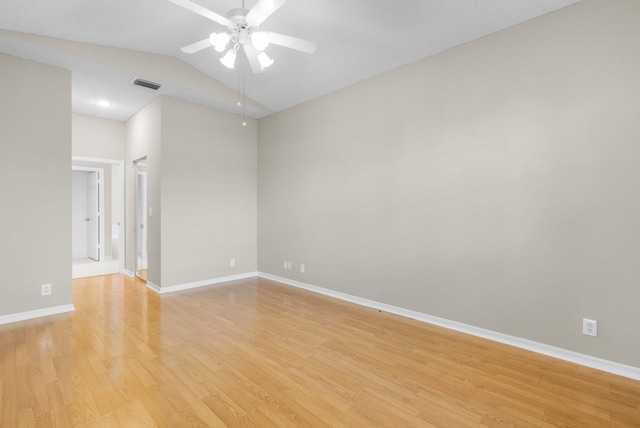 2274 SW Olympic Club Ter, Palm City, FL 34990 - spare room with light wood finished floors, a ceiling fan, baseboards, and vaulted ceiling