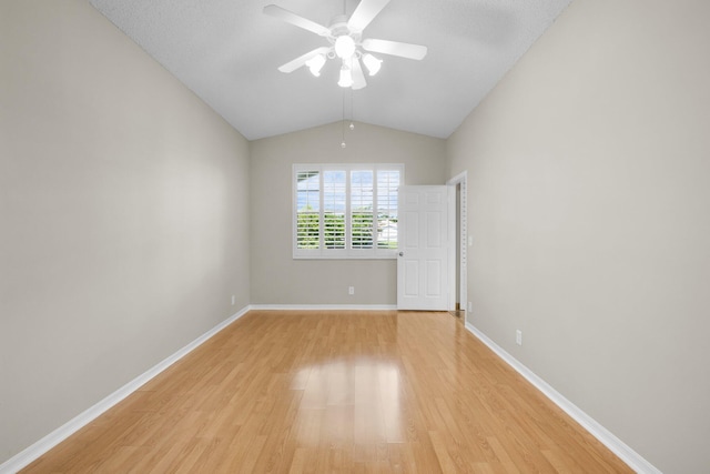 2274 SW Olympic Club Ter, Palm City, FL 34990 - empty room with a ceiling fan, light wood-style flooring, lofted ceiling, and baseboards