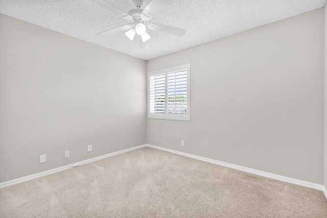 2274 SW Olympic Club Ter, Palm City, FL 34990 - unfurnished room with carpet, baseboards, a ceiling fan, and a textured ceiling