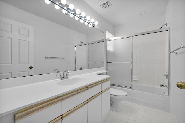 2274 SW Olympic Club Ter, Palm City, FL 34990 - bathroom with tile patterned flooring, vanity, toilet, and combined bath / shower with glass door