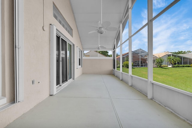 2274 SW Olympic Club Ter, Palm City, FL 34990 - unfurnished sunroom featuring a ceiling fan and a residential view