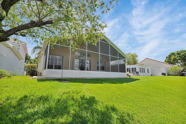 2274 SW Olympic Club Ter, Palm City, FL 34990 - rear view of property with a sunroom and a yard
