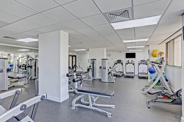5600 N Flagler Dr Unit 605, West Palm Beach, FL 33407 - exercise room featuring baseboards and a drop ceiling