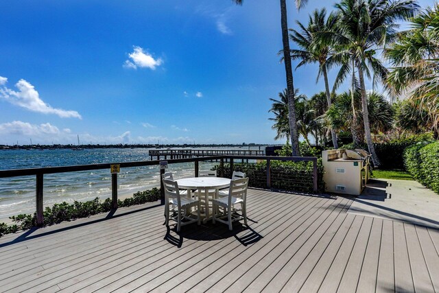 5600 N Flagler Dr Unit 605, West Palm Beach, FL 33407 - wooden deck with a water view and outdoor dining area