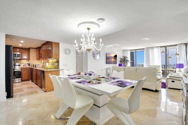 5600 N Flagler Dr Unit 605, West Palm Beach, FL 33407 - dining area featuring a chandelier and recessed lighting