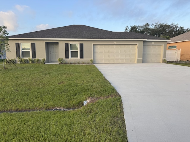 1462 SW Herder Rd, Port Saint Lucie, FL 34953 - single story home featuring stucco siding, an attached garage, concrete driveway, and a front lawn