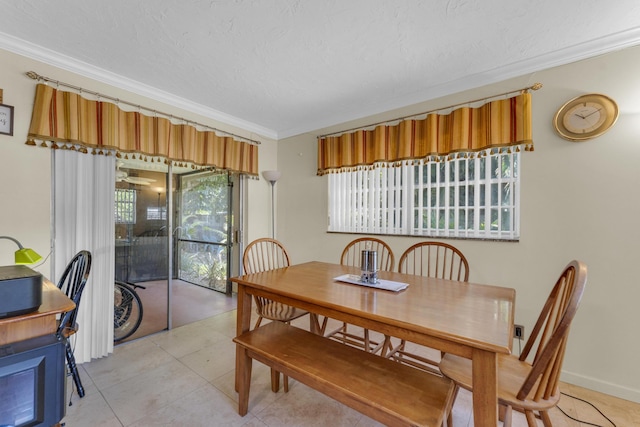 8858 SW 8th St, Boca Raton, FL 33433 - kitchen with stainless steel appliances, crown molding, dark stone counters, brown cabinetry, and hanging light fixtures