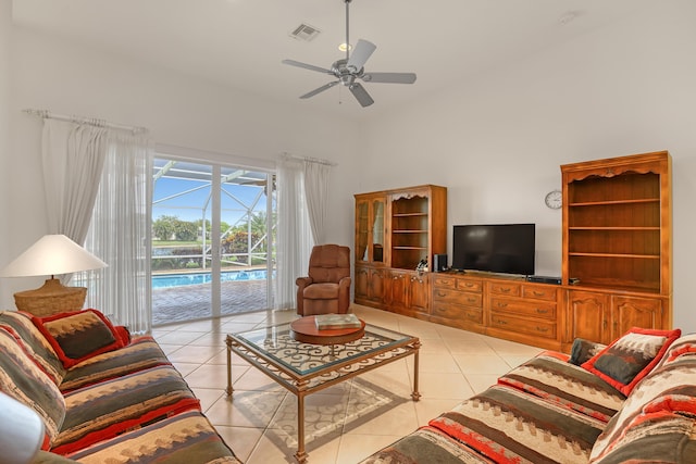 9466 Lantern Bay Cir, West Palm Beach, FL 33411 - living area featuring a ceiling fan, light tile patterned flooring, a sunroom, and a high ceiling
