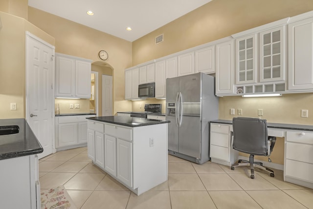 9466 Lantern Bay Cir, West Palm Beach, FL 33411 - kitchen featuring black appliances, white cabinets, glass insert cabinets, a center island, and recessed lighting