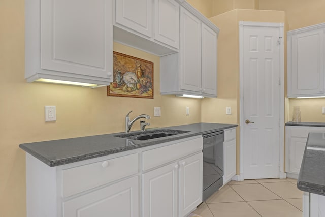 9466 Lantern Bay Cir, West Palm Beach, FL 33411 - kitchen with black dishwasher, a sink, dark countertops, and white cabinets