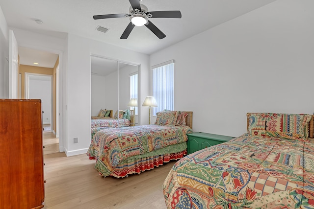9466 Lantern Bay Cir, West Palm Beach, FL 33411 - bedroom with light wood-style floors and a ceiling fan
