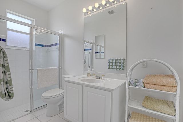 9466 Lantern Bay Cir, West Palm Beach, FL 33411 - bathroom with toilet, a stall shower, vanity, and tile patterned floors