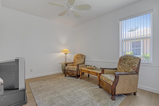 9466 Lantern Bay Cir, West Palm Beach, FL 33411 - living area featuring a ceiling fan, baseboards, and wood finished floors