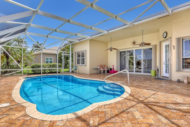 9466 Lantern Bay Cir, West Palm Beach, FL 33411 - outdoor pool with a patio area, a ceiling fan, and glass enclosure