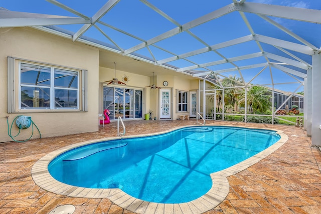 9466 Lantern Bay Cir, West Palm Beach, FL 33411 - outdoor pool featuring a patio area, ceiling fan, and glass enclosure