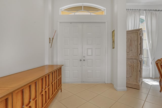 9466 Lantern Bay Cir, West Palm Beach, FL 33411 - foyer entrance featuring light tile patterned floors and baseboards