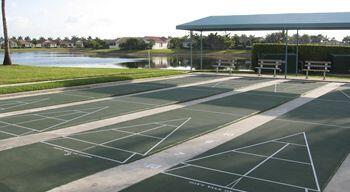 9466 Lantern Bay Cir, West Palm Beach, FL 33411 - surrounding community with a water view and shuffleboard
