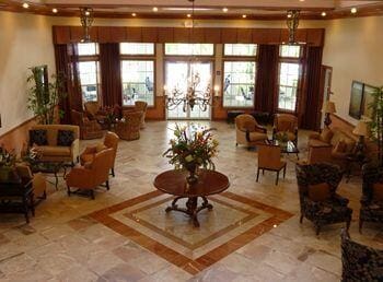 9466 Lantern Bay Cir, West Palm Beach, FL 33411 - building lobby featuring a towering ceiling and recessed lighting
