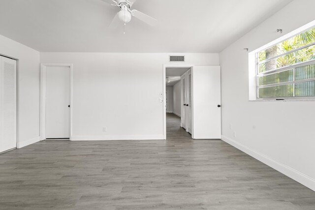 938 Normandy T 938, Delray Beach, FL 33484 - spare room featuring ceiling fan, wood finished floors, and baseboards