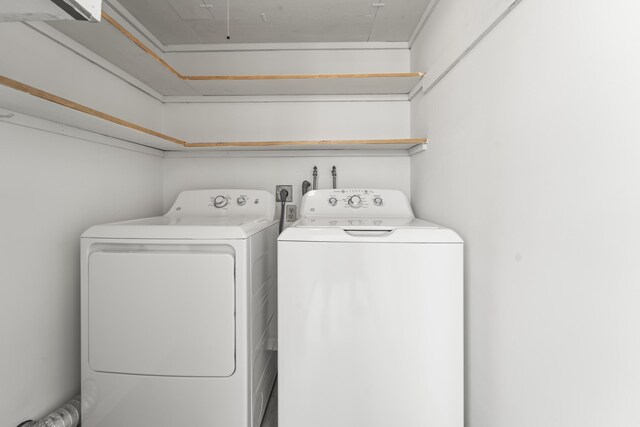 938 Normandy T 938, Delray Beach, FL 33484 - laundry area with independent washer and dryer and attic access