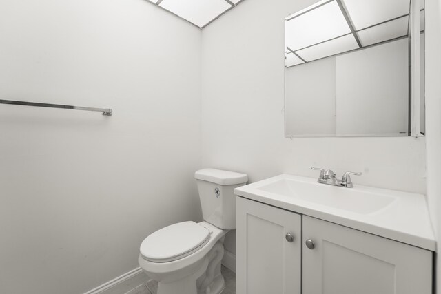 938 Normandy T 938, Delray Beach, FL 33484 - bathroom with vanity, baseboards, and toilet