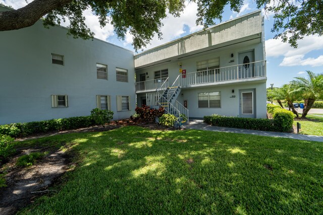 938 Normandy T 938, Delray Beach, FL 33484 - view of property featuring stairway