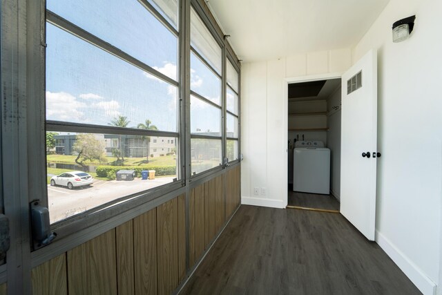 938 Normandy T 938, Delray Beach, FL 33484 - unfurnished sunroom featuring washer / dryer and plenty of natural light