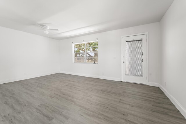 938 Normandy T 938, Delray Beach, FL 33484 - empty room featuring ceiling fan, wood finished floors, and baseboards
