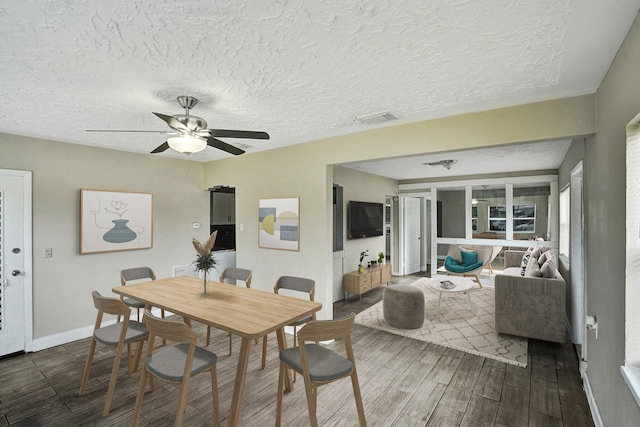 4701 N Andrews Ave, Oakland Park, FL 33309 - dining area with wood finished floors, a ceiling fan, a textured ceiling, and baseboards