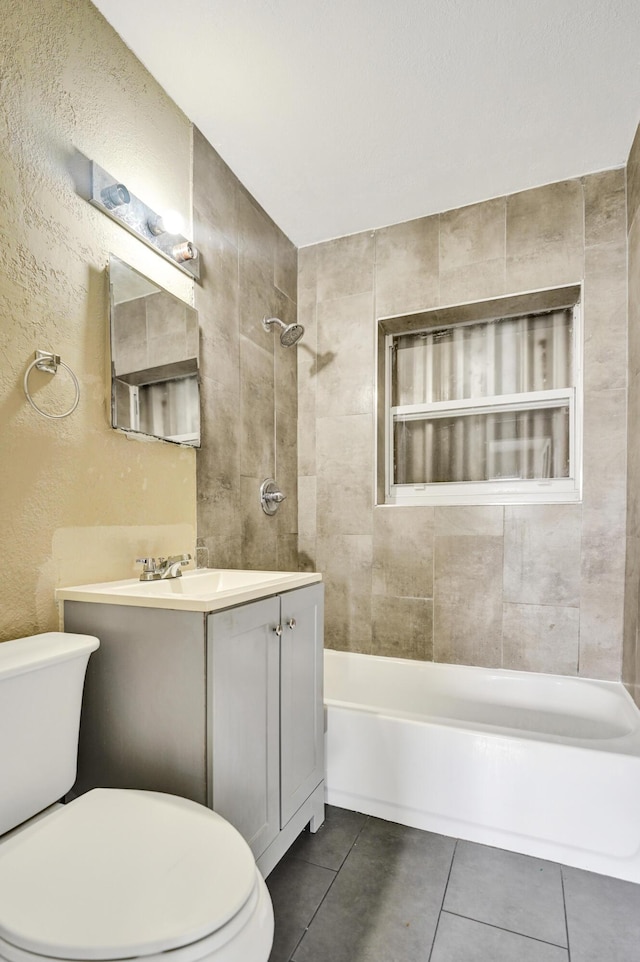 4701 N Andrews Ave, Oakland Park, FL 33309 - full bathroom with toilet, vanity, tile patterned flooring,  shower combination, and a textured wall