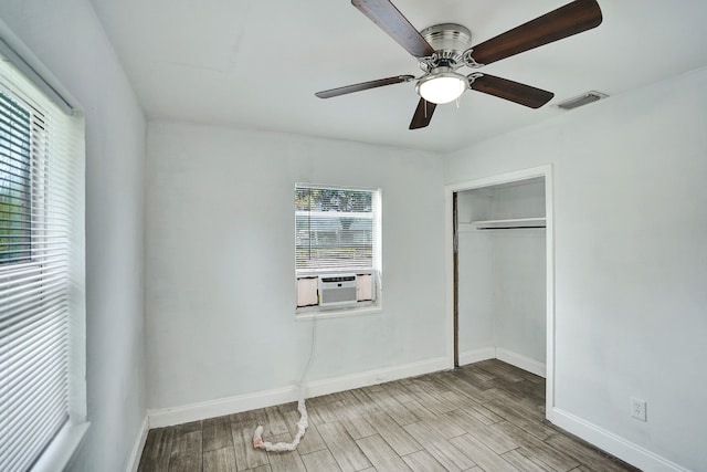 4701 N Andrews Ave, Oakland Park, FL 33309 - unfurnished bedroom with baseboards, wood finished floors, a ceiling fan, and a closet