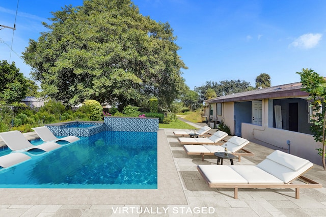 4701 N Andrews Ave, Oakland Park, FL 33309 - swimming pool featuring a hot tub and a patio