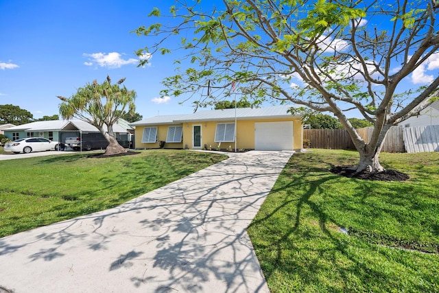 333 SE Dalva Ave, Port Saint Lucie, FL 34984 - ranch-style home with a garage, stucco siding, concrete driveway, and metal roof