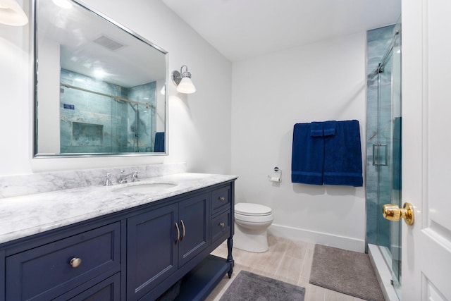 333 SE Dalva Ave, Port Saint Lucie, FL 34984 - full bathroom featuring vanity, a shower stall, toilet, and baseboards