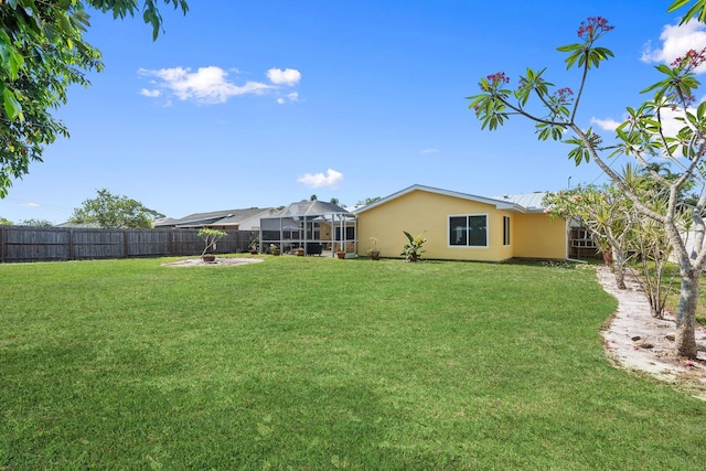 333 SE Dalva Ave, Port Saint Lucie, FL 34984 - view of yard with a lanai