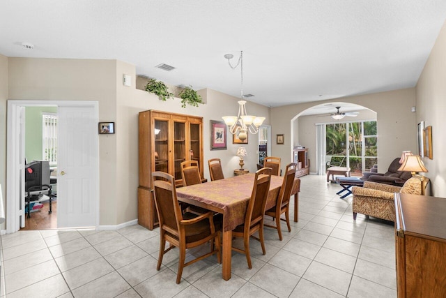 5871 Grand Harbour Cir, Boynton Beach, FL 33437 - dining space with arched walkways, a chandelier, light tile patterned floors, and baseboards