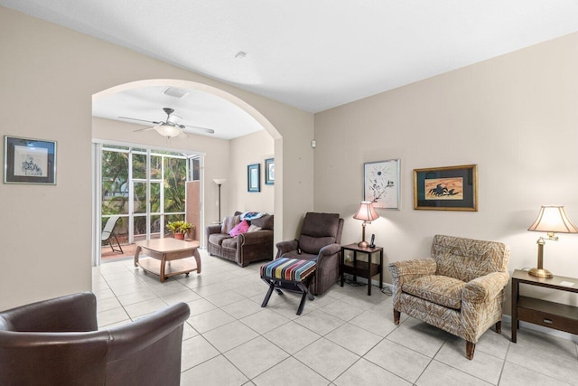 5871 Grand Harbour Cir, Boynton Beach, FL 33437 - living area featuring arched walkways, a ceiling fan, and light tile patterned floors