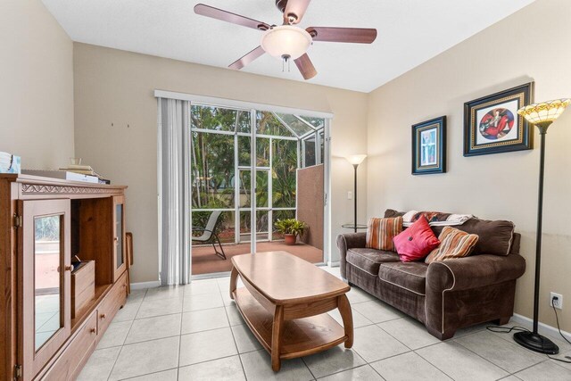 5871 Grand Harbour Cir, Boynton Beach, FL 33437 - living room with ceiling fan, light tile patterned floors, and baseboards