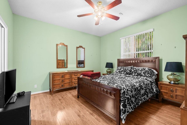 5871 Grand Harbour Cir, Boynton Beach, FL 33437 - bedroom with light wood-style floors, ceiling fan, and baseboards