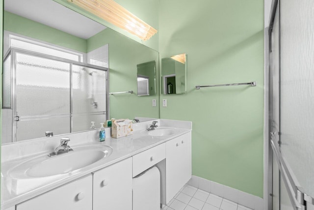 5871 Grand Harbour Cir, Boynton Beach, FL 33437 - full bath with double vanity, tile patterned flooring, a shower stall, and baseboards