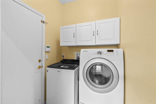 5871 Grand Harbour Cir, Boynton Beach, FL 33437 - laundry room with cabinet space and independent washer and dryer