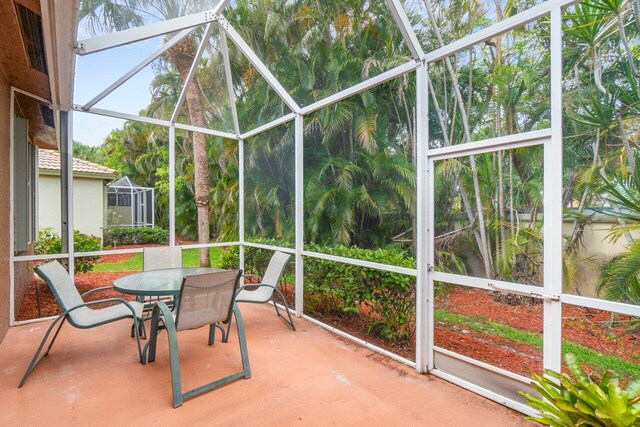 5871 Grand Harbour Cir, Boynton Beach, FL 33437 - sunroom featuring outdoor dining area