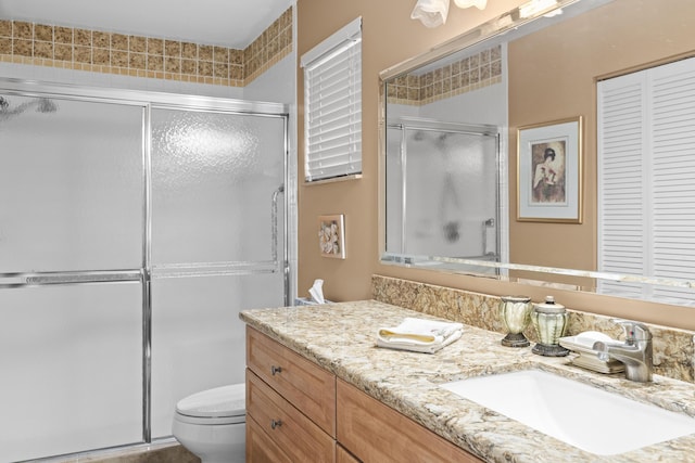6067 Kings Gate Cir, Delray Beach, FL 33484 - full bath with vanity, toilet, and a shower with door