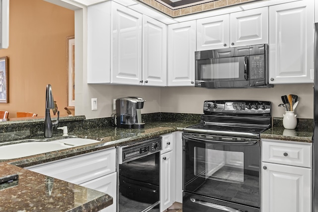 6067 Kings Gate Cir, Delray Beach, FL 33484 - kitchen featuring black appliances, a sink, white cabinets, and dark stone counters