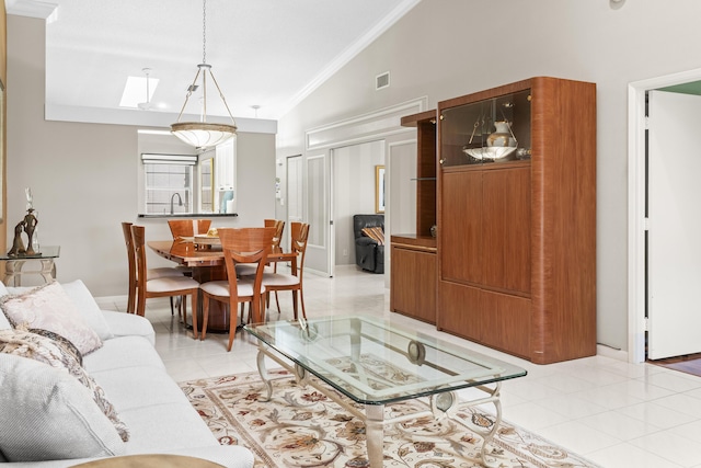 6067 Kings Gate Cir, Delray Beach, FL 33484 - living area featuring light tile patterned flooring, crown molding, and high vaulted ceiling